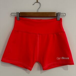 Sport shorts, brand is Gym Beam, color is pink/red. Size S.